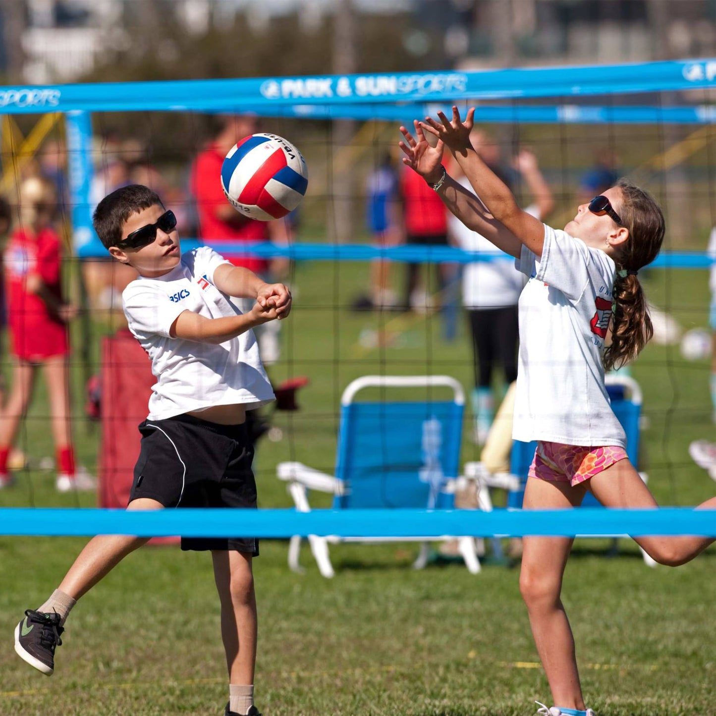 Park & Sun Sports kids playing on USYVL youth volleyball set